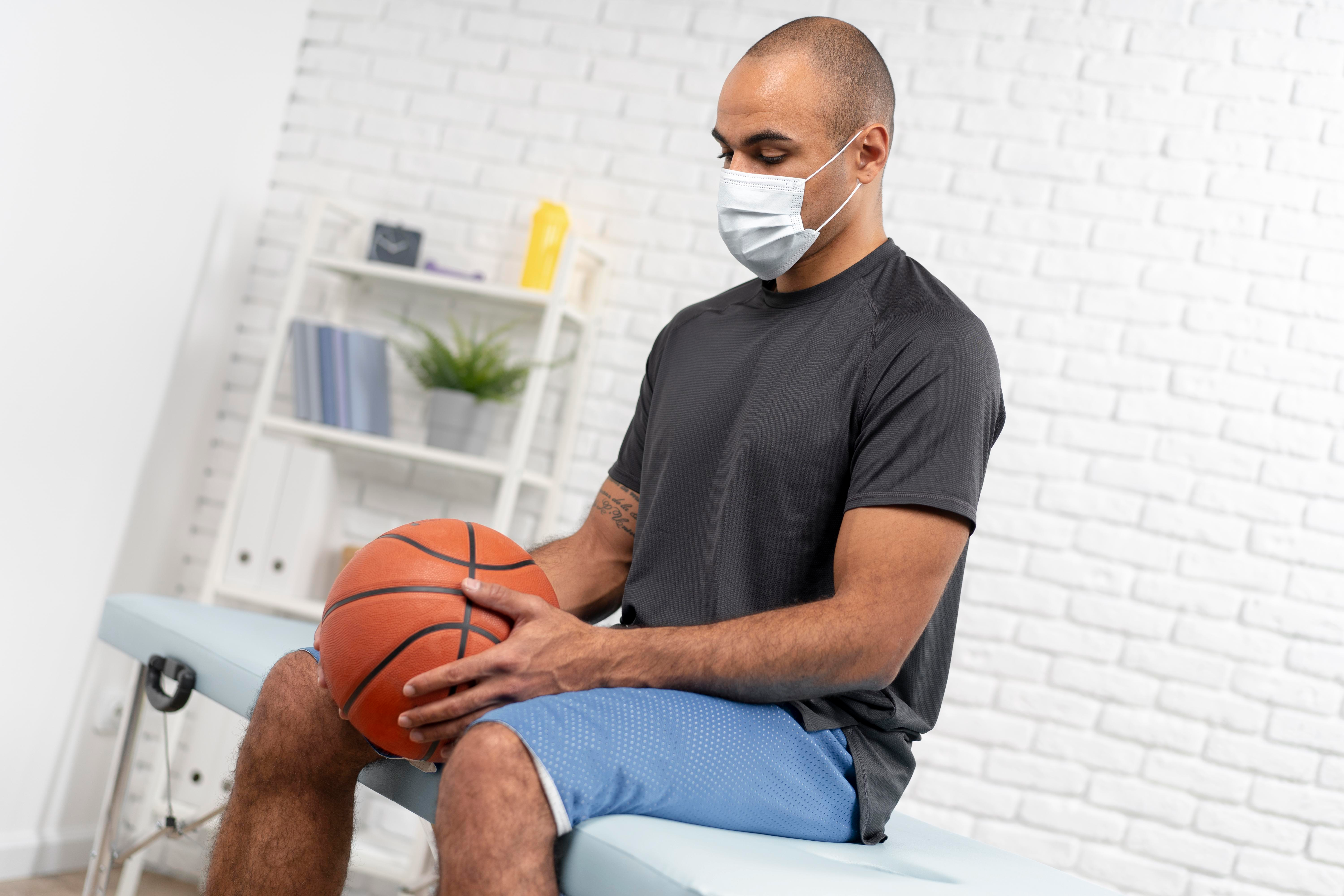 man-with-medical-mask-basketball-physiotherapy man-with-medical-mask-basketball-physiotherapy