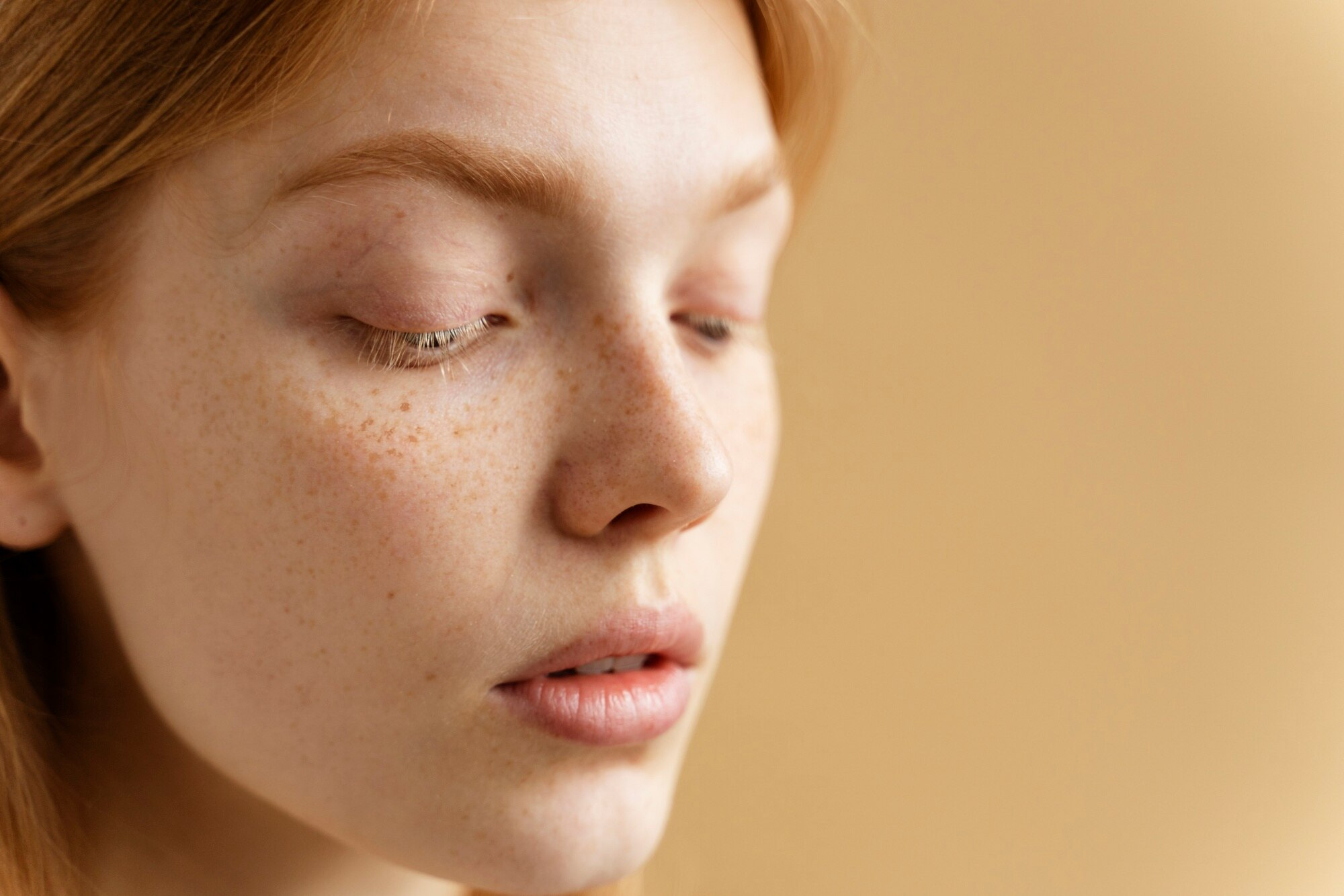 Young woman with freckles close up
